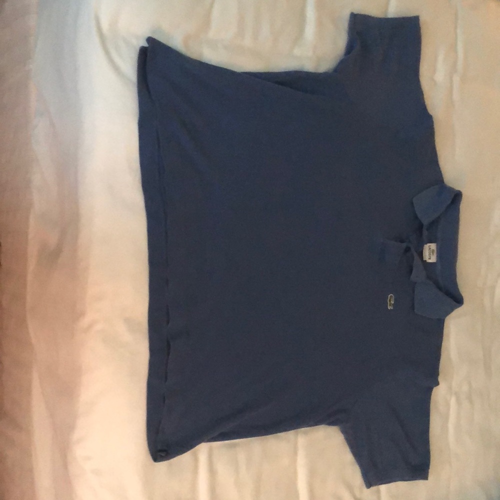 This is a light blue Lacoste polo shirt